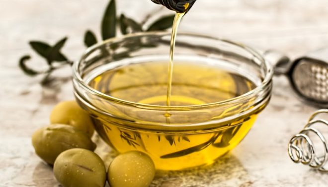 bowl of olive oil with vegan olives