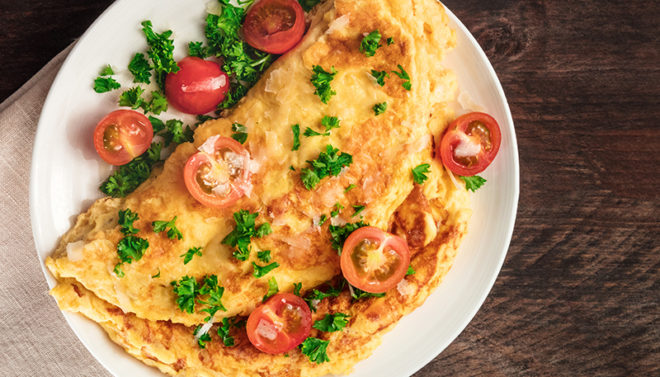 lunch ideas - omelette with tomatoes and herb garnish