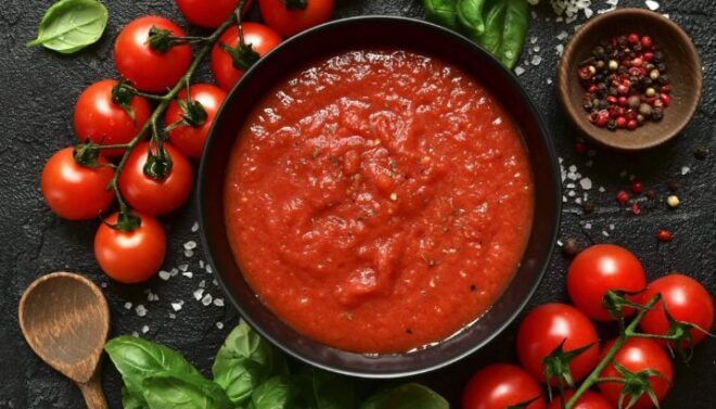 Homemade tomato sauce passata - traditional recipe of italian cuisine.Top view with copy space.